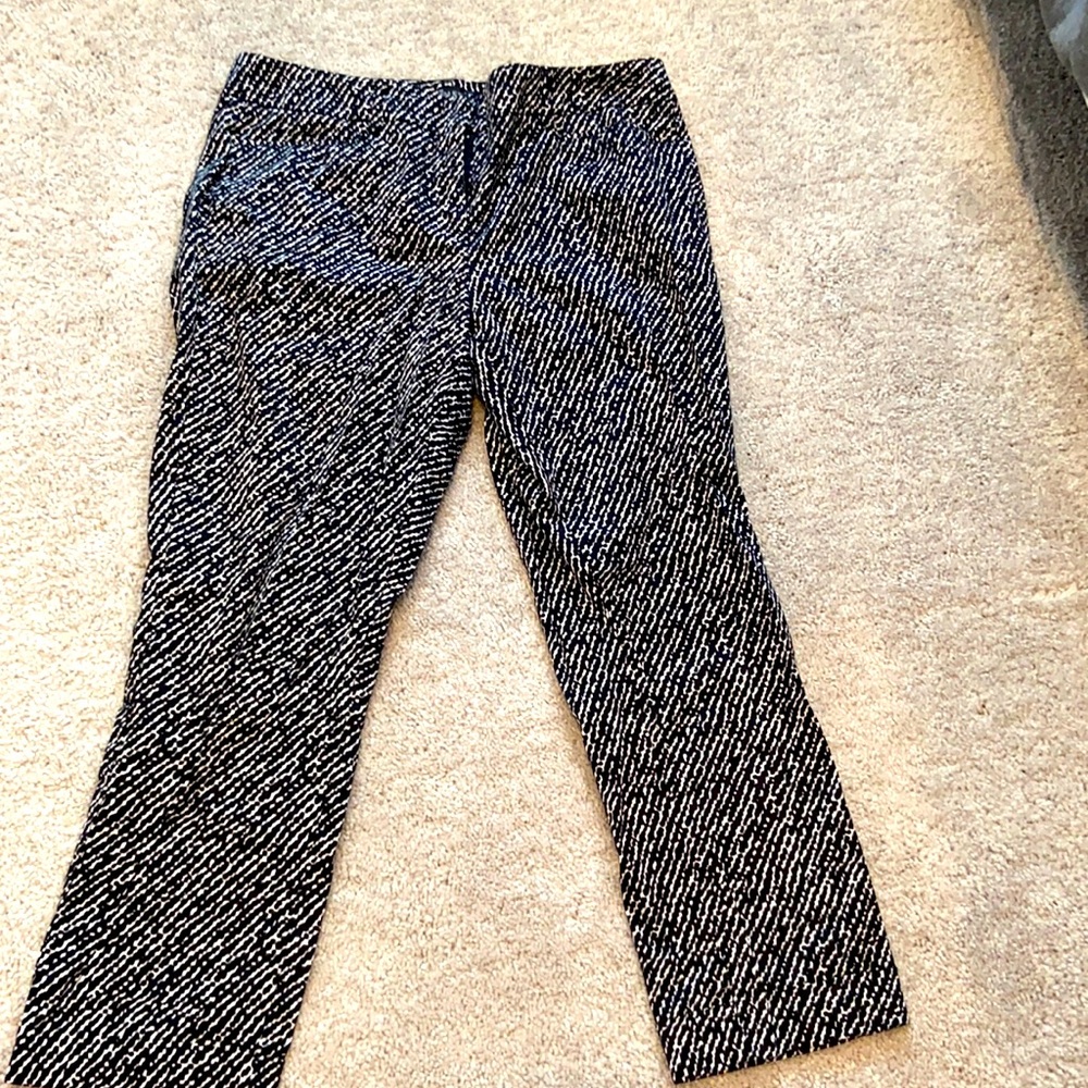 Black and white ankle work pants with faux pockets on the back